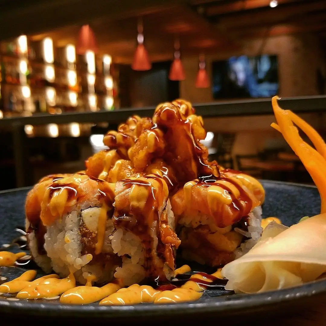 Fried sushi roll with intimate bar ambiance