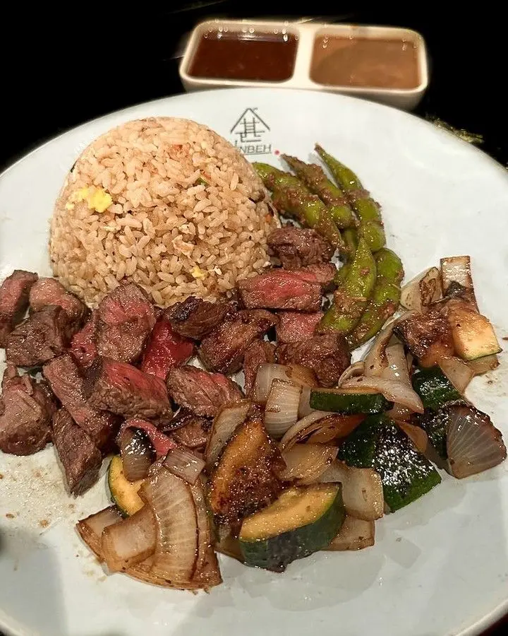 NY strip steak cooking on the hibachi grill