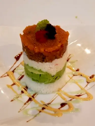 Ahi Tuna Tower, layered ahi tuna, avocado, and crispy wonton