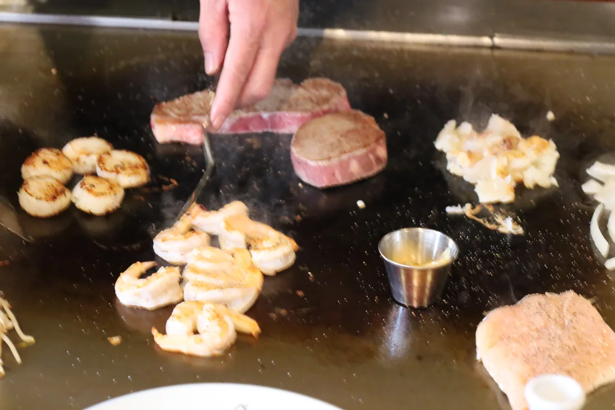 Hibachi catering Lewisville TX β Jinbeh drop-off tray with steak, shrimp, fried rice