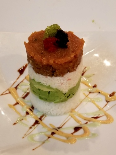 Ahi Tuna Tower, layered ahi tuna, avocado, and crispy wonton