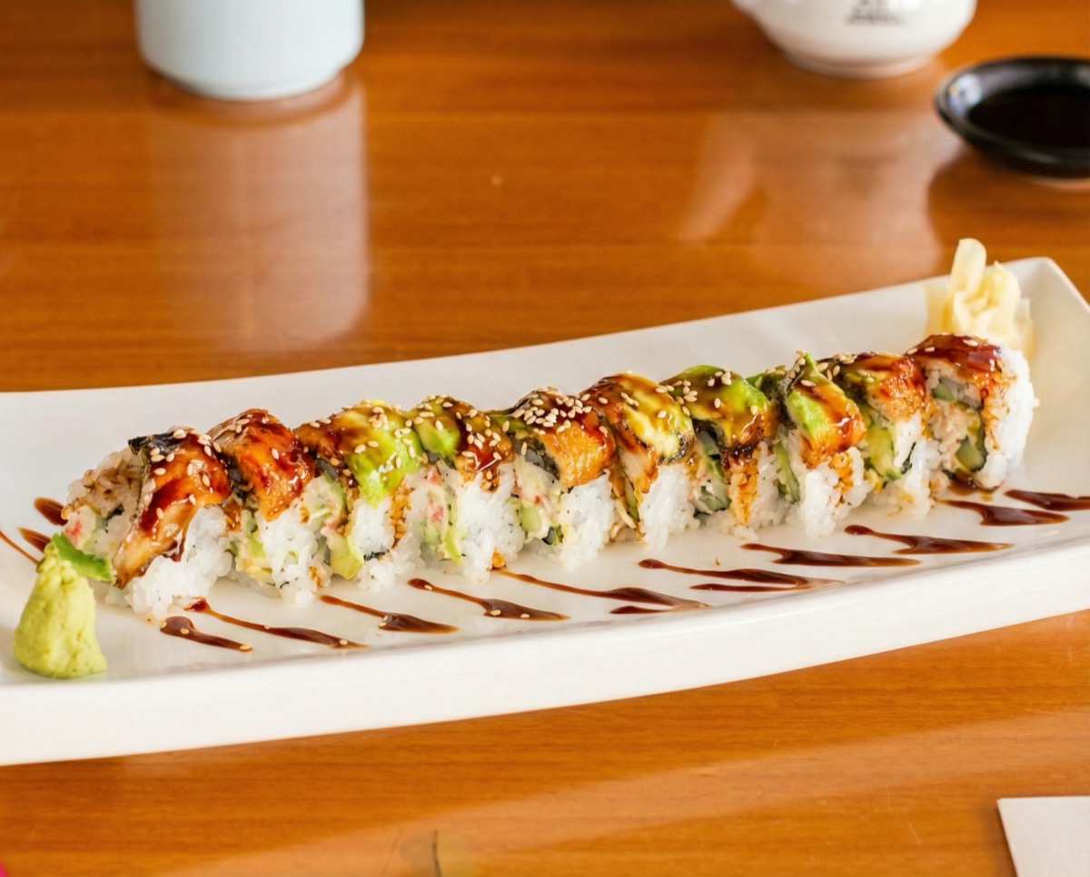 Dragon Roll, eel and cucumber topped with avocado and eel sauce