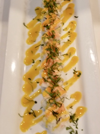 Tiger Roll, shrimp tempura with spicy tuna and jalapeño